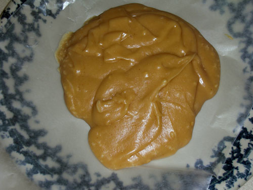 Peanut butter fudge after pouring and setting.